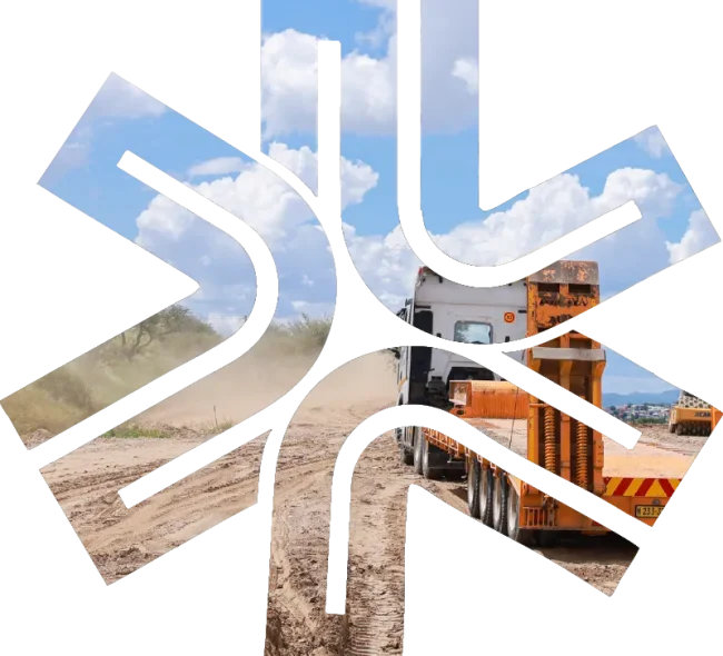 Truck driving on a gravel road.